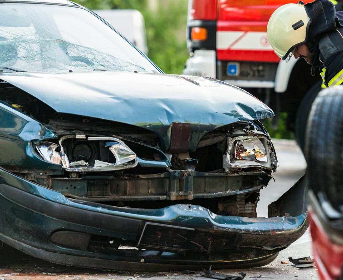 A serious car accident on a busy street in St. Louis, with significant damage to the front of the vehicle.