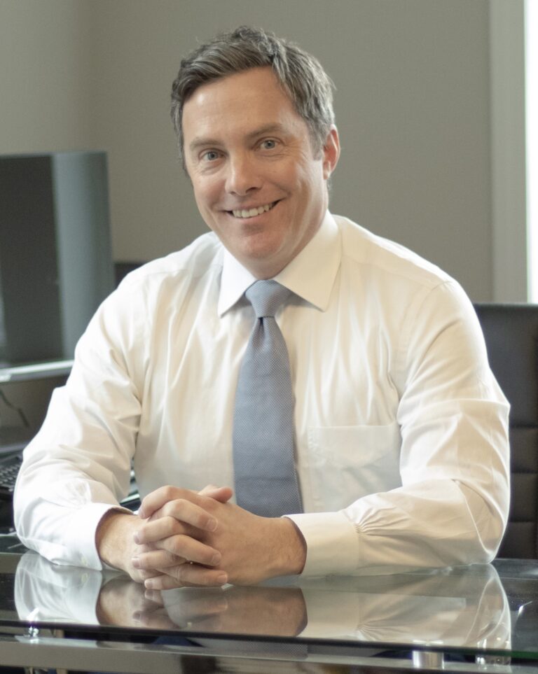 Personal injury lawyer in St. Louis sitting at his desk.